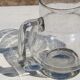 Vintage blown glass pitcher with bubbles, transparent.