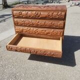 Compact 4-drawer ethnic chest of drawers carved with scenes of African life