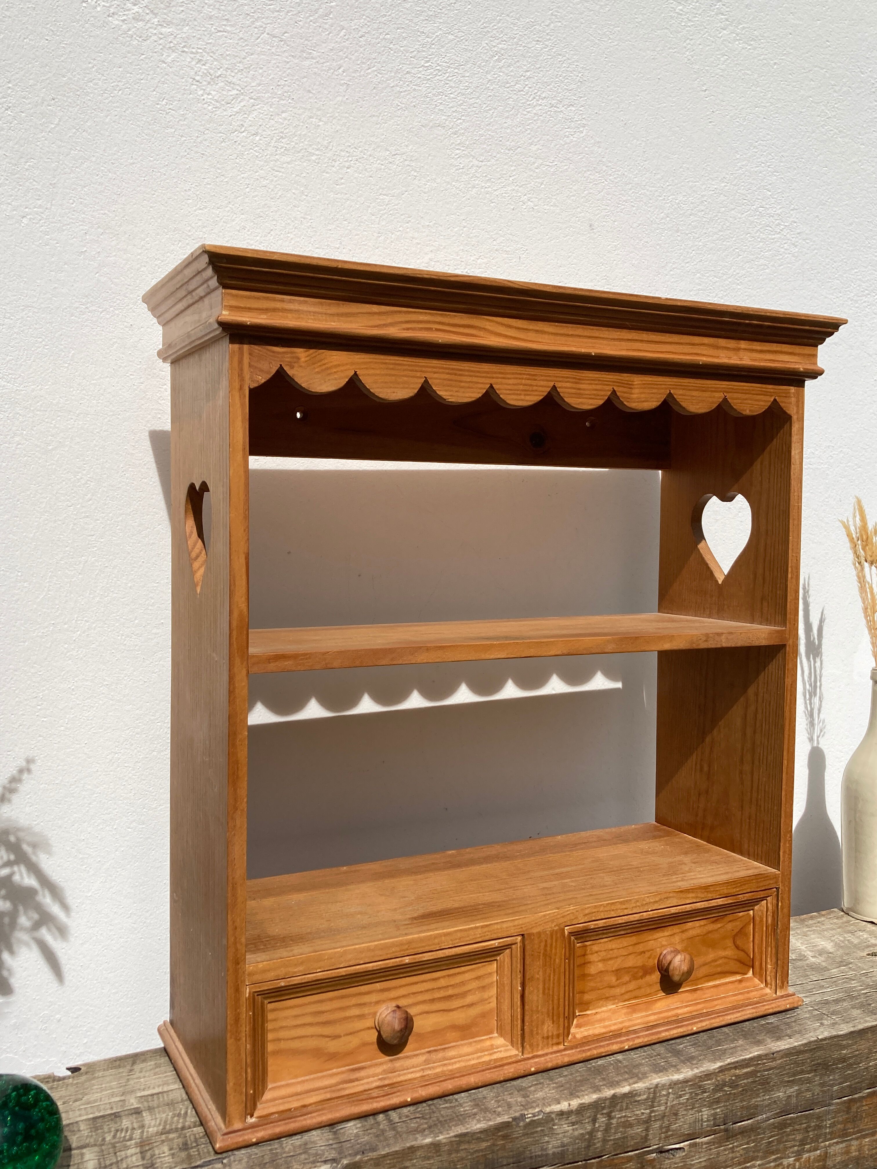 Wall shelf in raw wood with drawers and openwork hearts