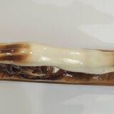 Beige and brown ceramic representing a “Greyhound/vintage 1930