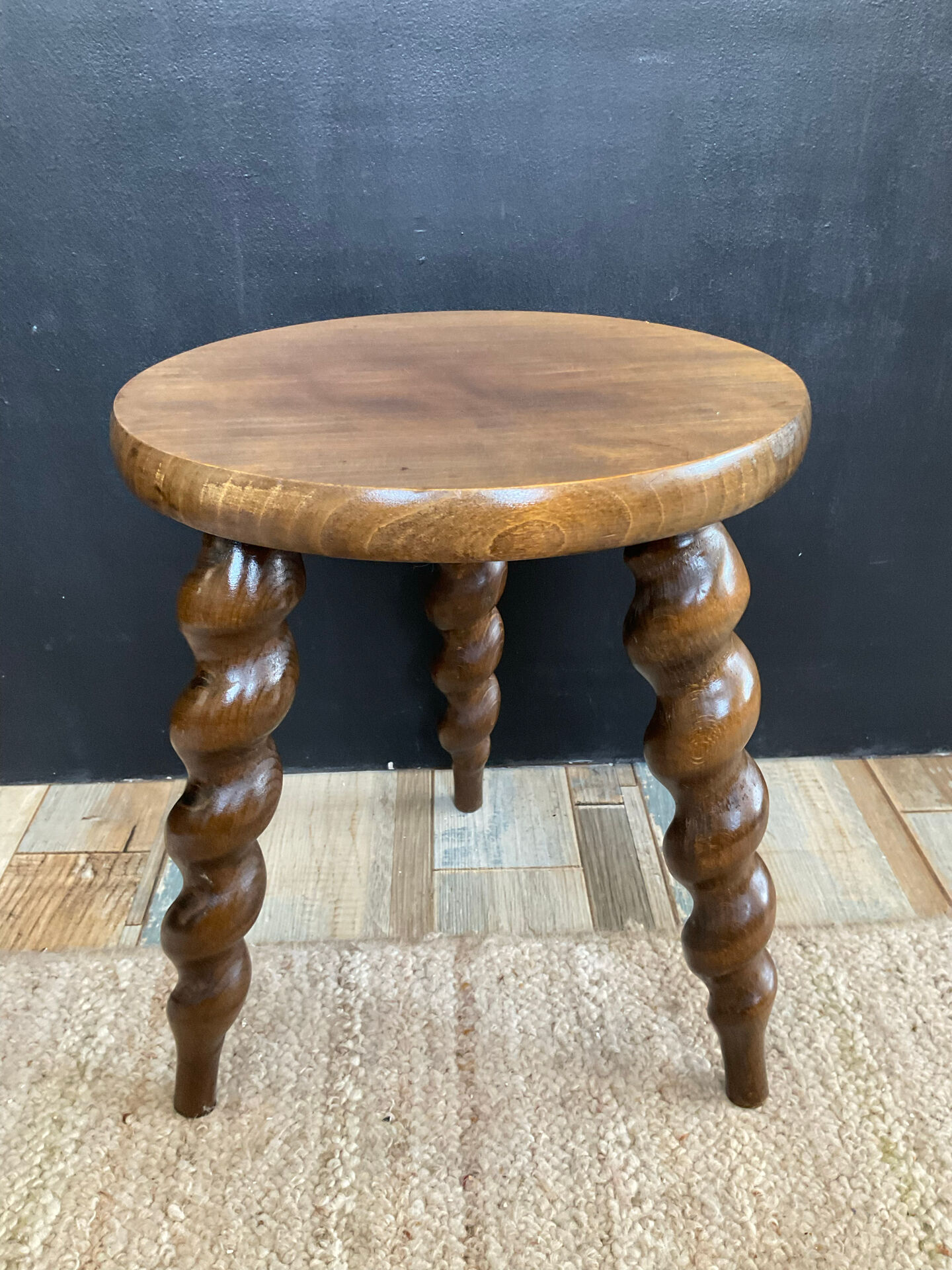 Antique tripod stool made of turned wood