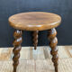 Antique tripod stool made of turned wood