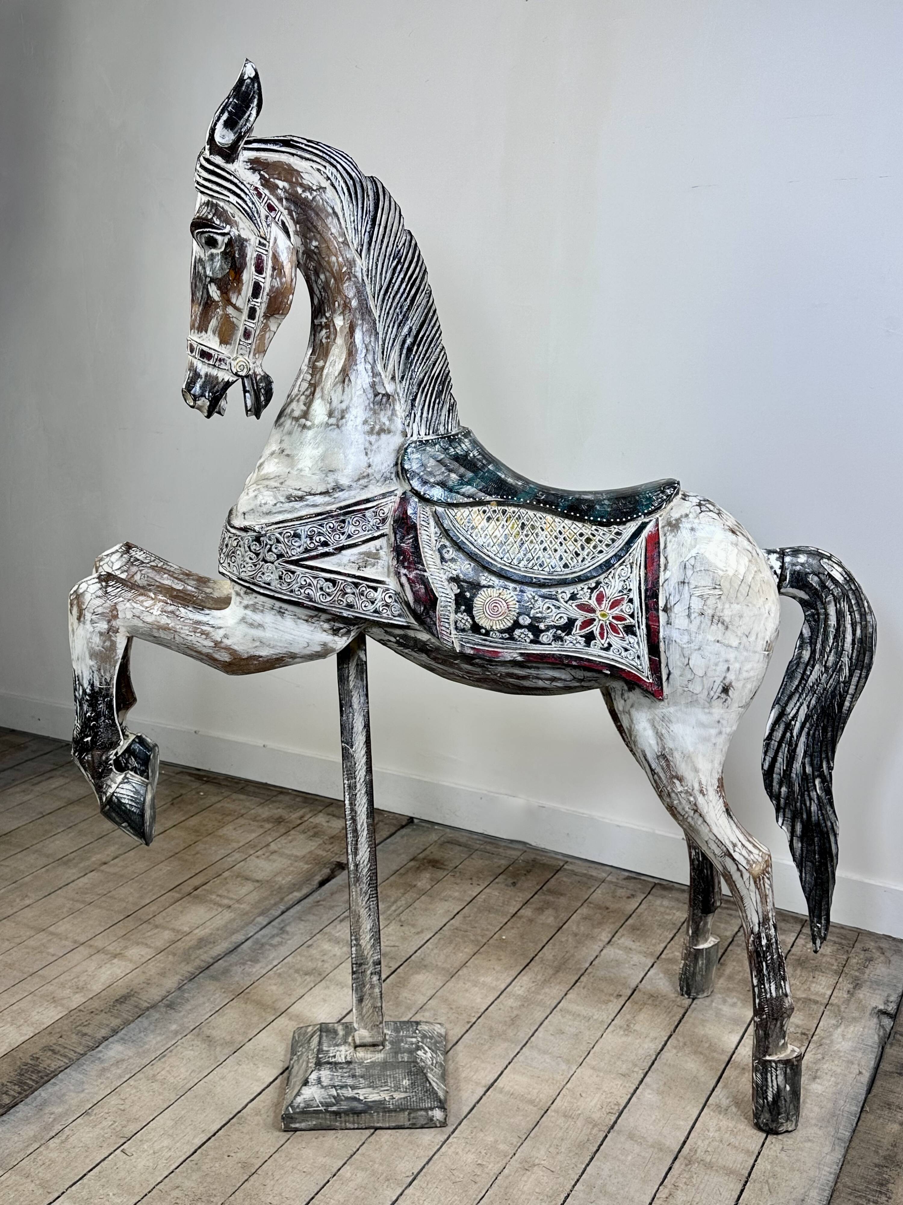 Carved and patinated wooden carousel horse