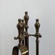 Pair of fire dogs and fireplace tools