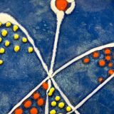 Large decorative dish signed André Baud, diameter 37 cm, enamelled decoration on a deep blue background