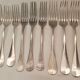 10 mismatched silver metal forks
