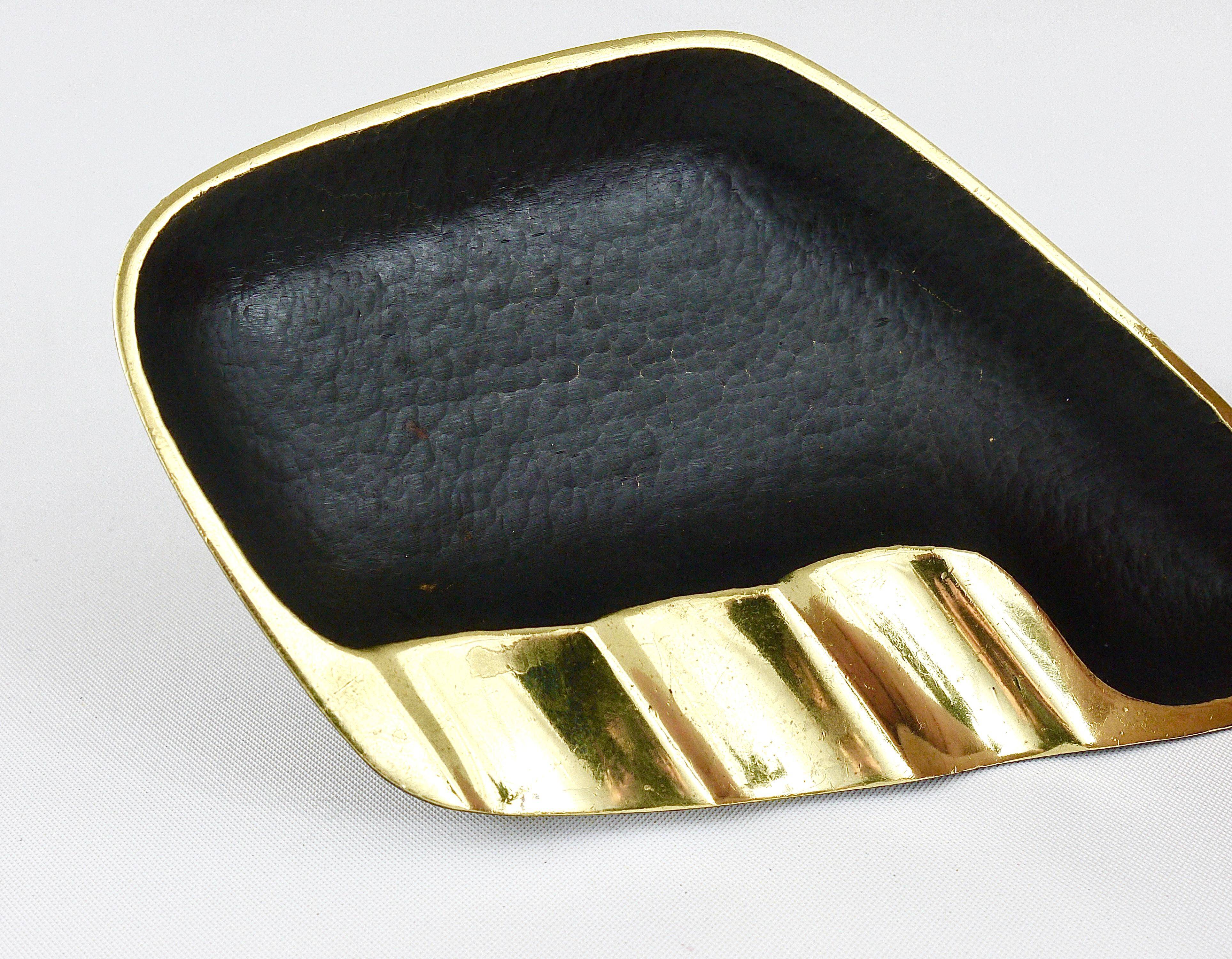 Asymmetrical modernist ashtray by Walter Bosse in black brass by Herta Baller, 1950s.