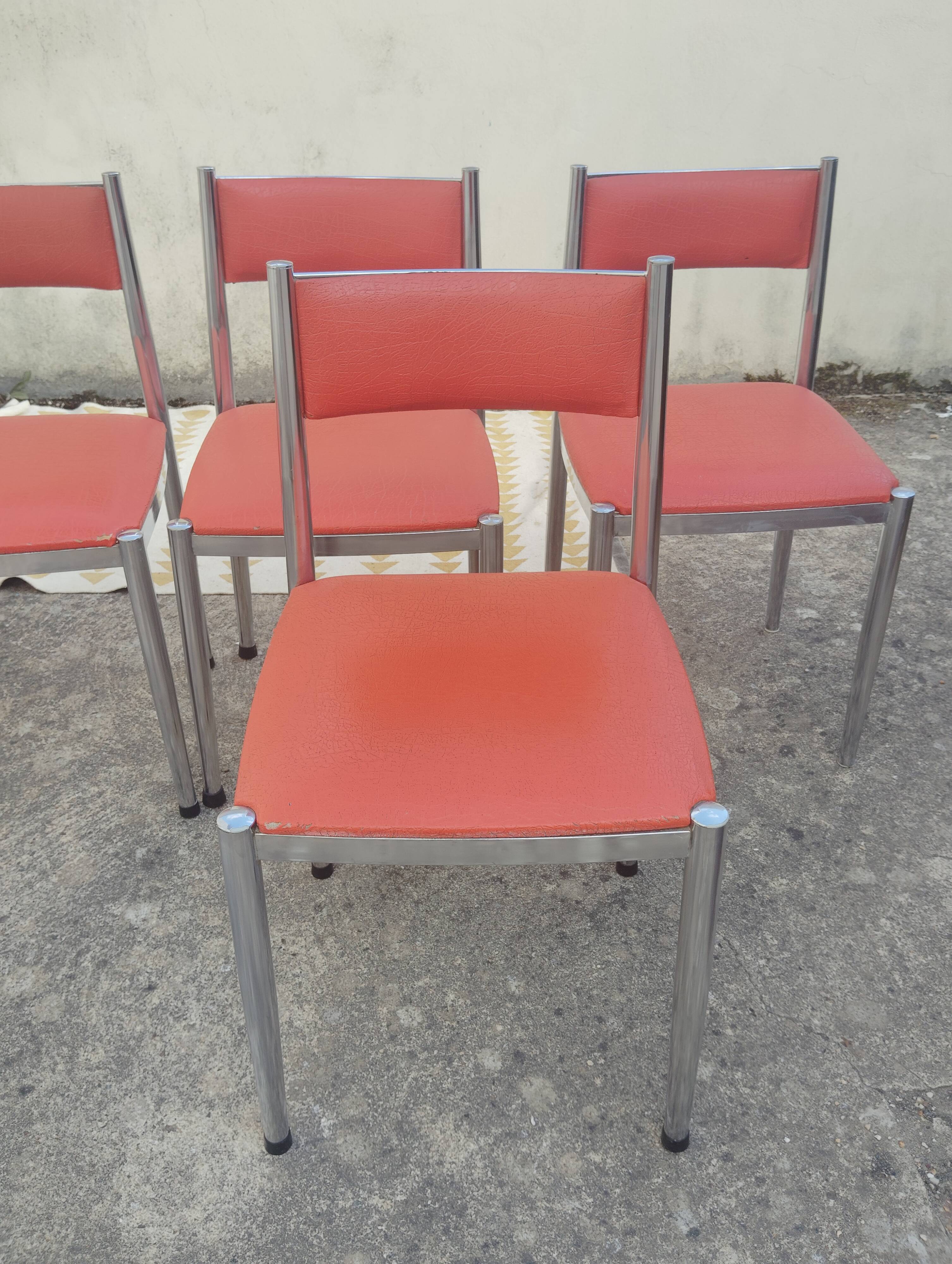 Set of 4 vintage chrome and orange faux leather chairs.