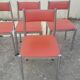 Set of 4 vintage chrome and orange faux leather chairs.