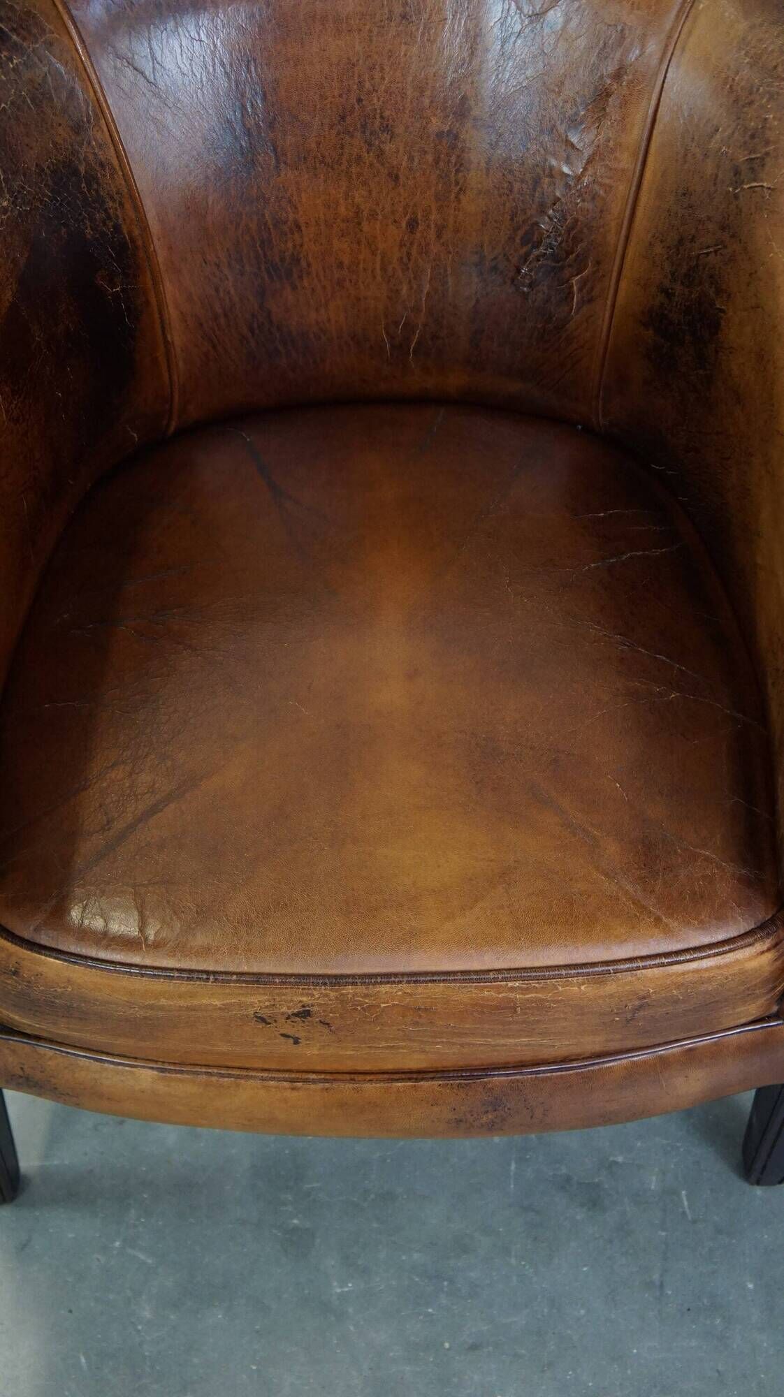 Sturdy, stately and subtle vintage sheepskin club chair