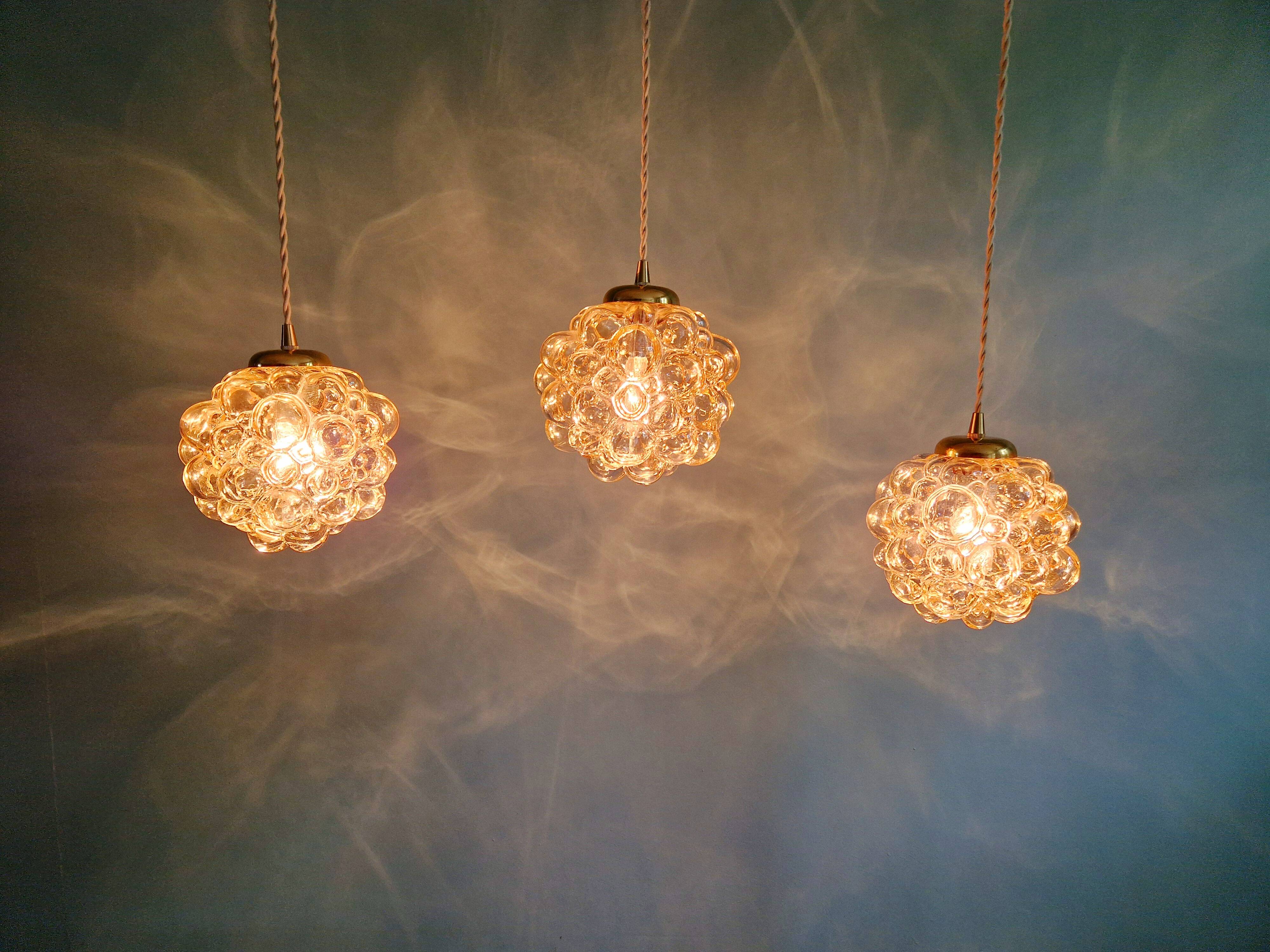 Amber bubble glass pendant (3 available), design by Helena Tynell, 1970.
