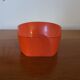 Vintage mechanical alarm clock in orange plastic Uti West Germany