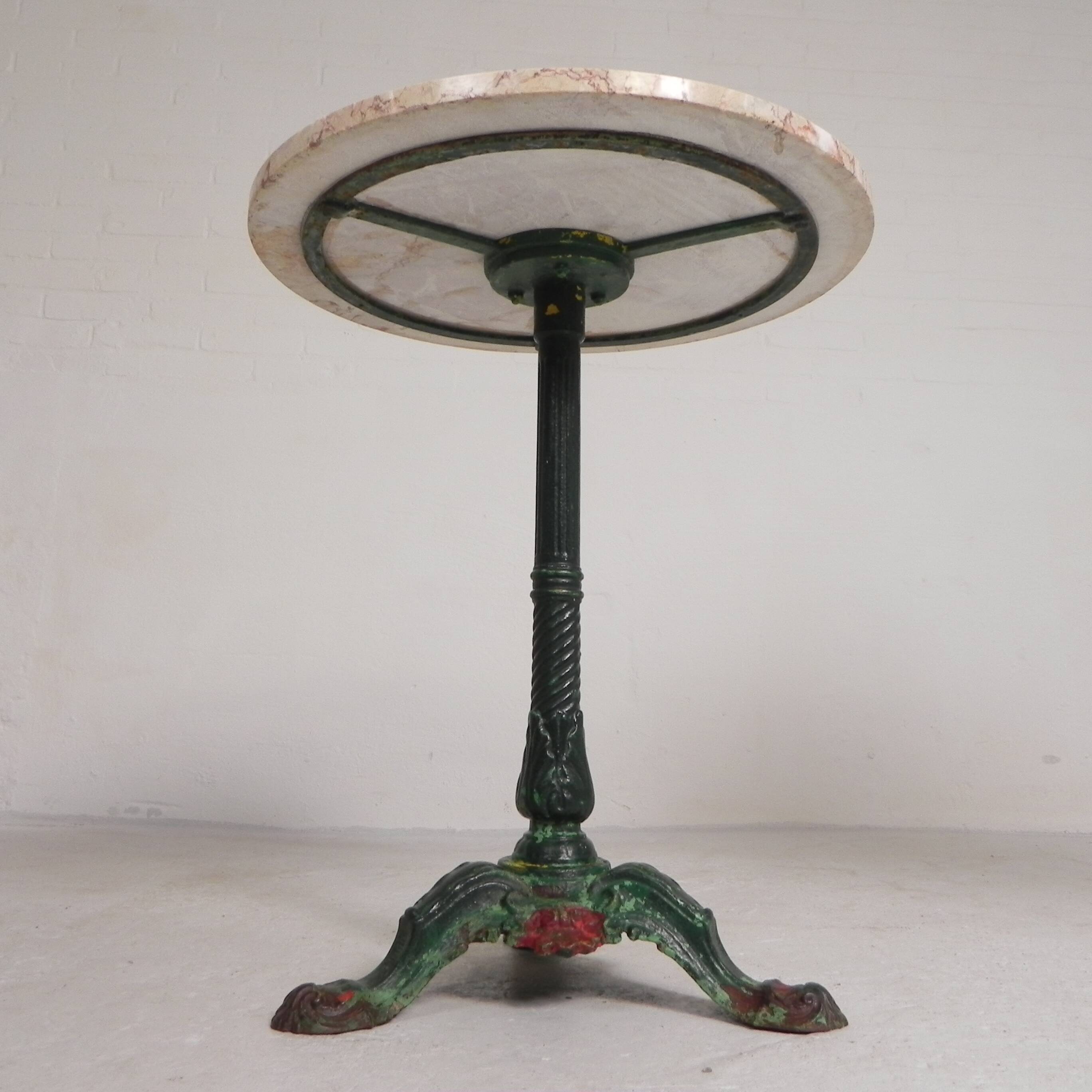 Bistro table with cast iron legs and marble top, 1920s.
