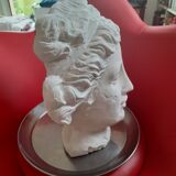 White plaster statue: man's head.