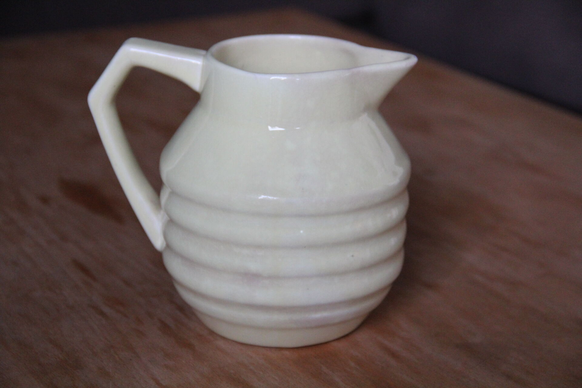 Art-deco pitcher in pale yellow earthenware