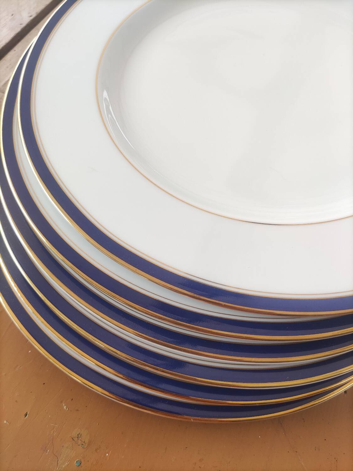 Six blue and gold Limoges porcelain dinner plates