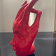 Vintage red ceramic hand paperweight