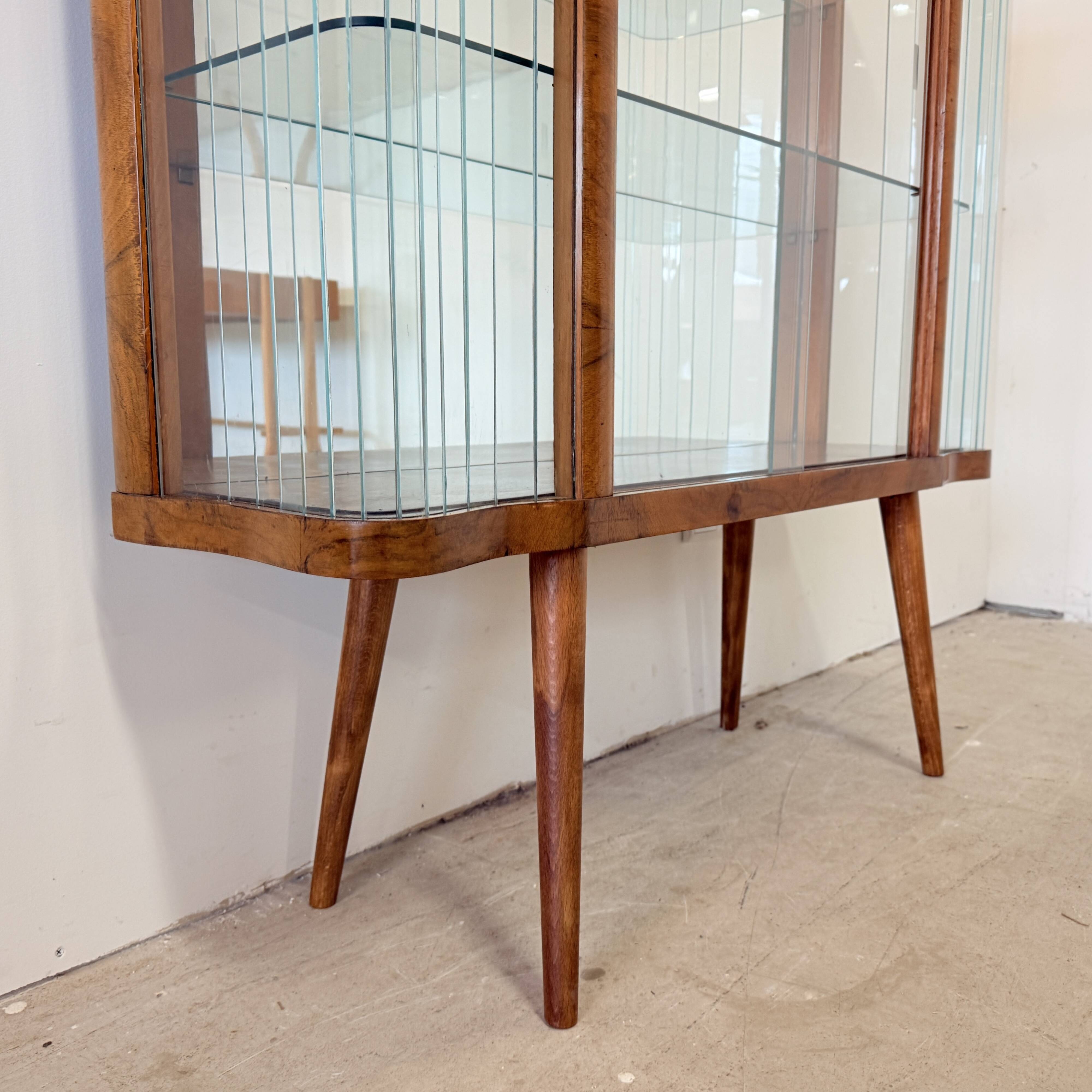 Elegant, curved display cabinet in Art Deco style
