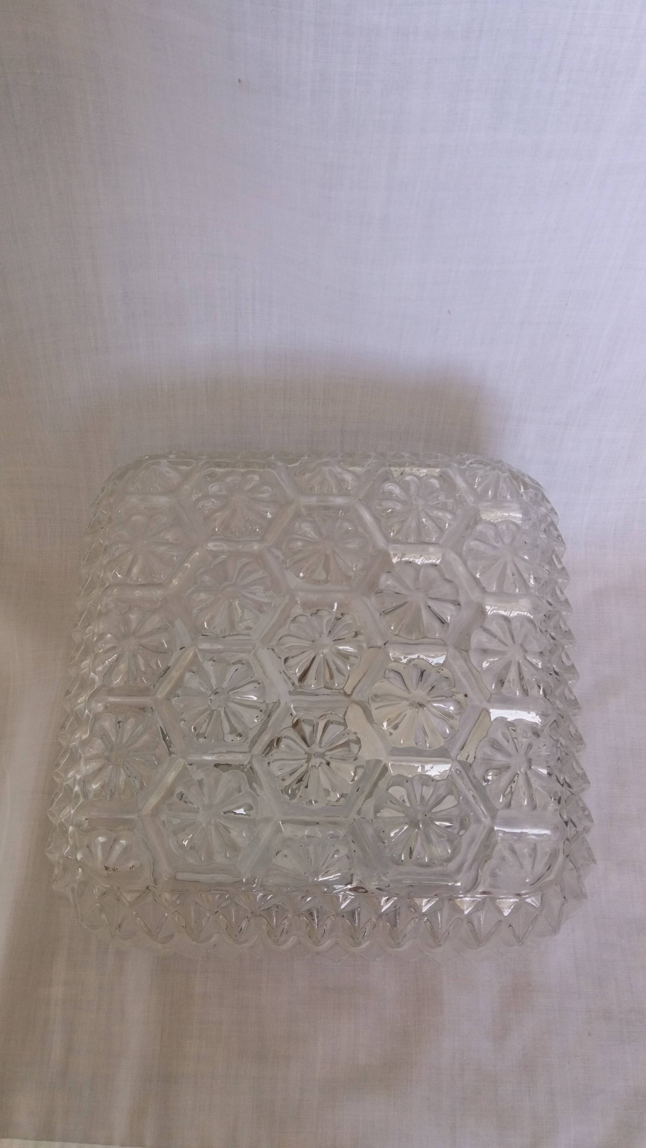 Square globe ceiling light in moulded glass.