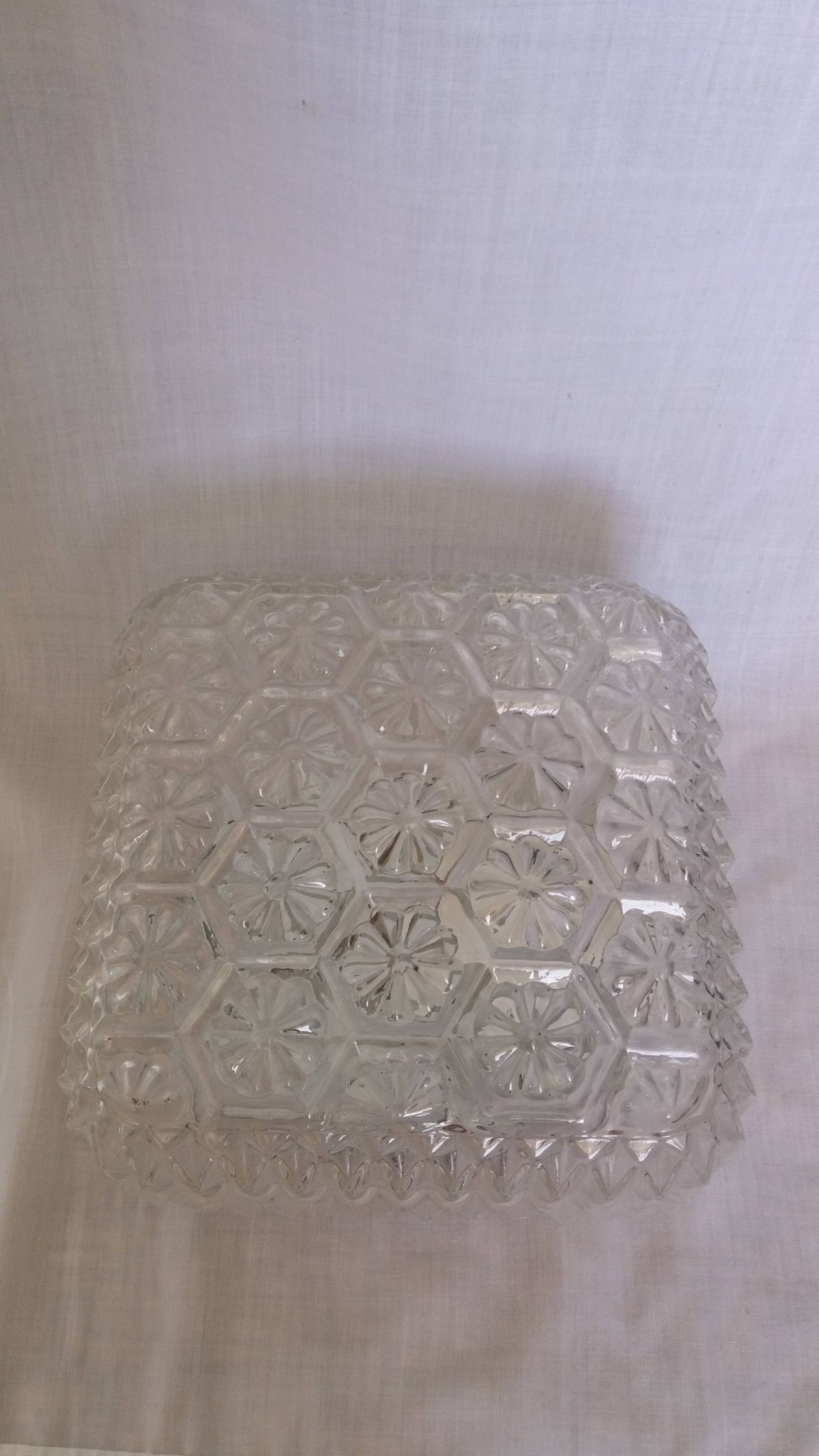 Square globe ceiling light in moulded glass.