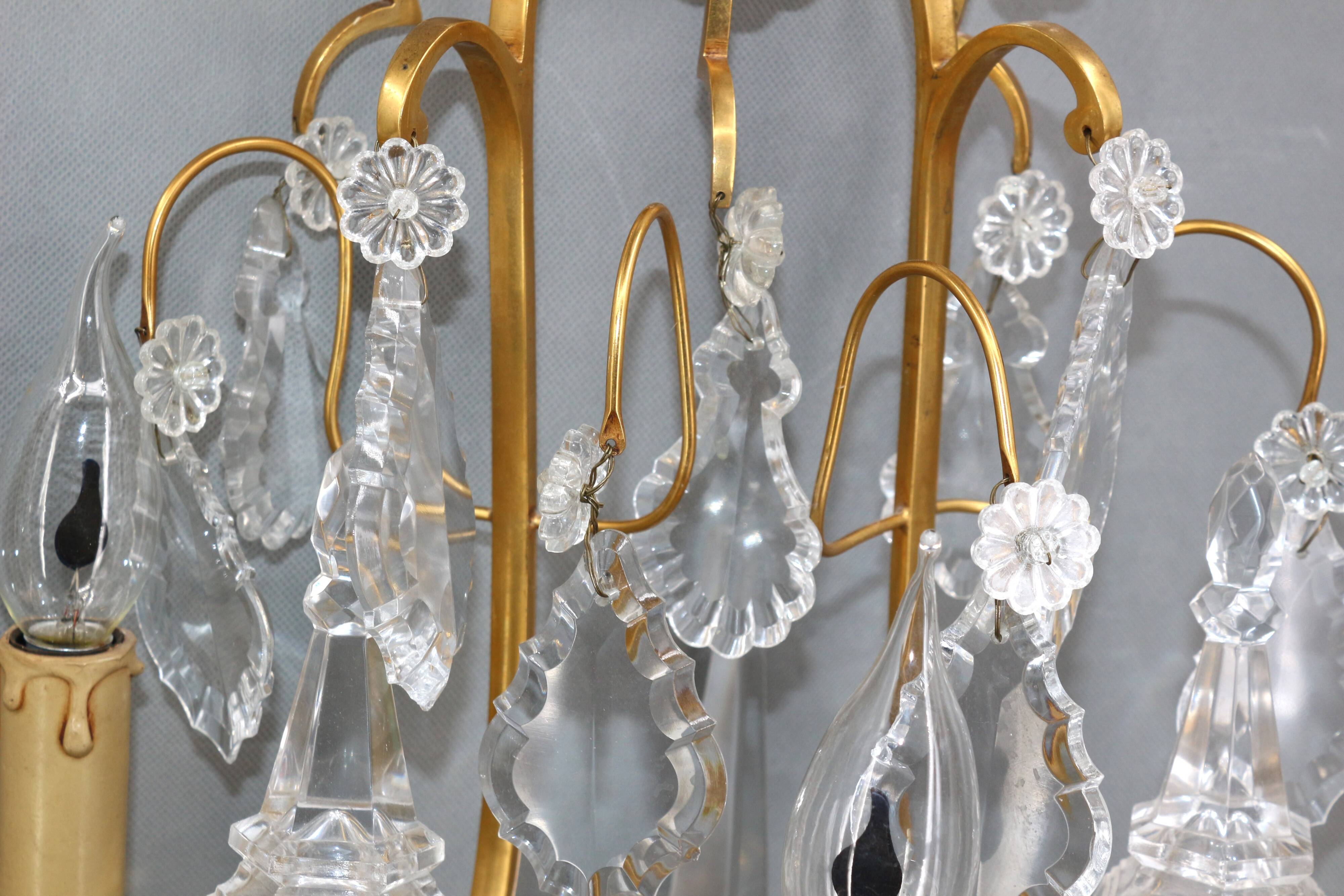 Pair of Louis XVI style gilded bronze & bohemian crystal sconces