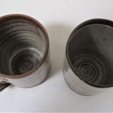 Two enamelled sandstone mugs Roger Jacques handwritten signature