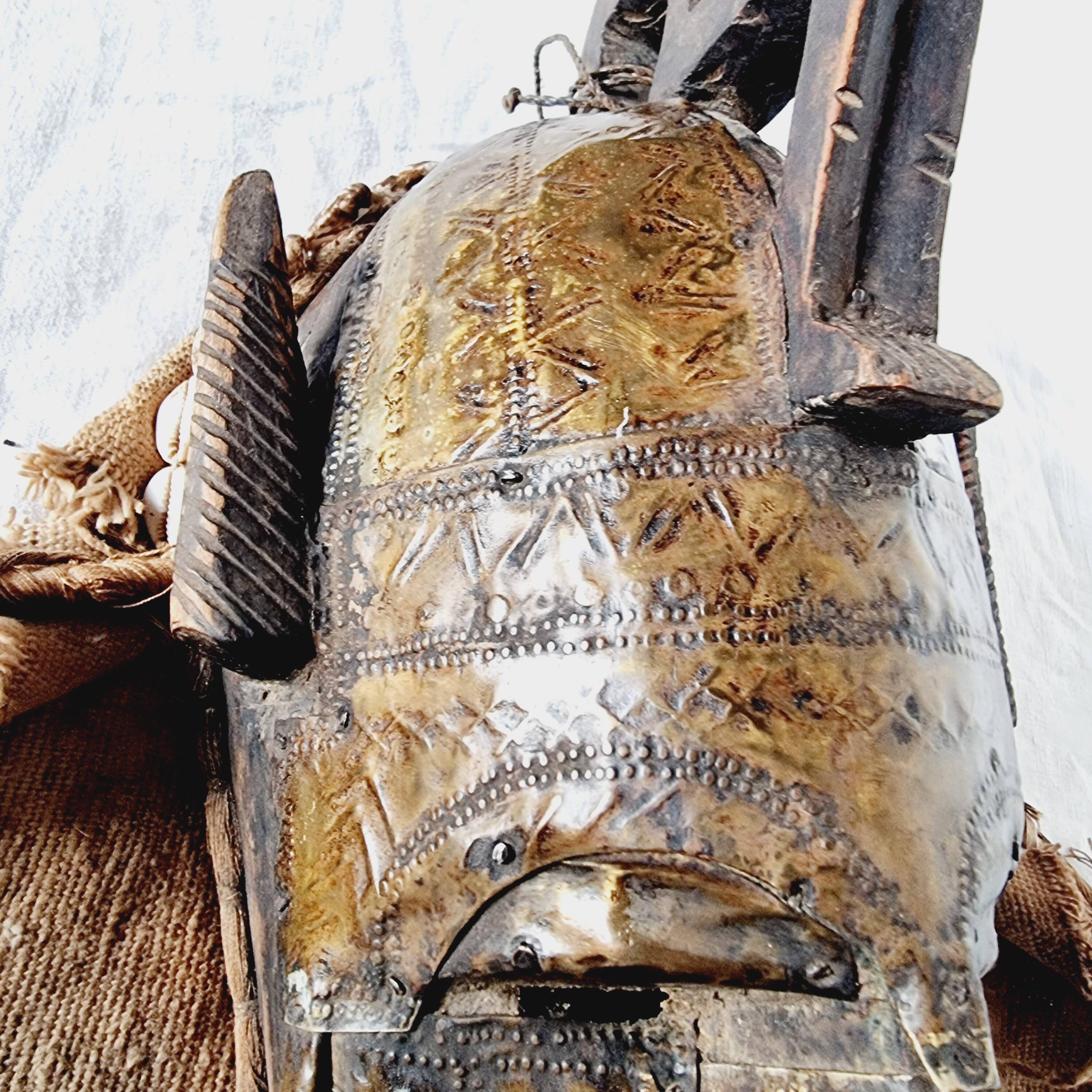 African mask from Mali from the N'Tomo tribe of Marka covered in chiseled brass