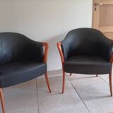 Pair of leather and wood armchairs in the Umberto Asnago style.