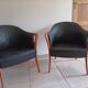 Pair of leather and wood armchairs in the style of Umberto Asnago.