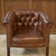 Paire de fauteuils Club capitonnés en cuir