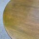 Extendable round table in solid wood with a dark oak satin finish.