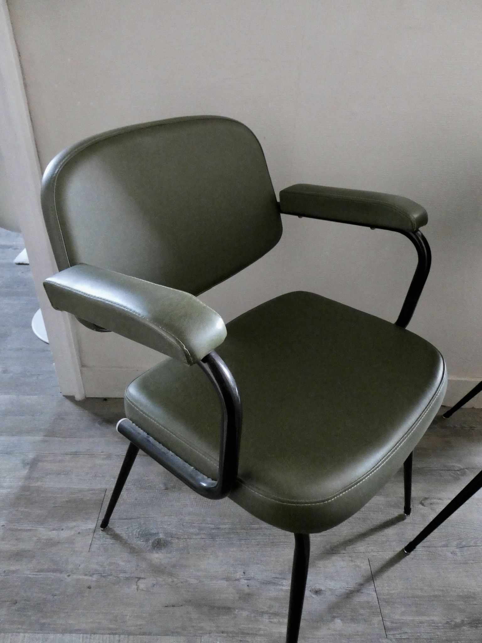 Pair of khaki green metal and skai armchairs from the 1960s