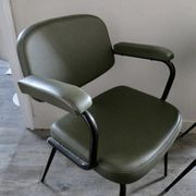 Pair of khaki green metal and skai armchairs from the 1960s