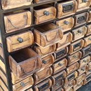 Black metal storage cabinet with 60 wooden drawers