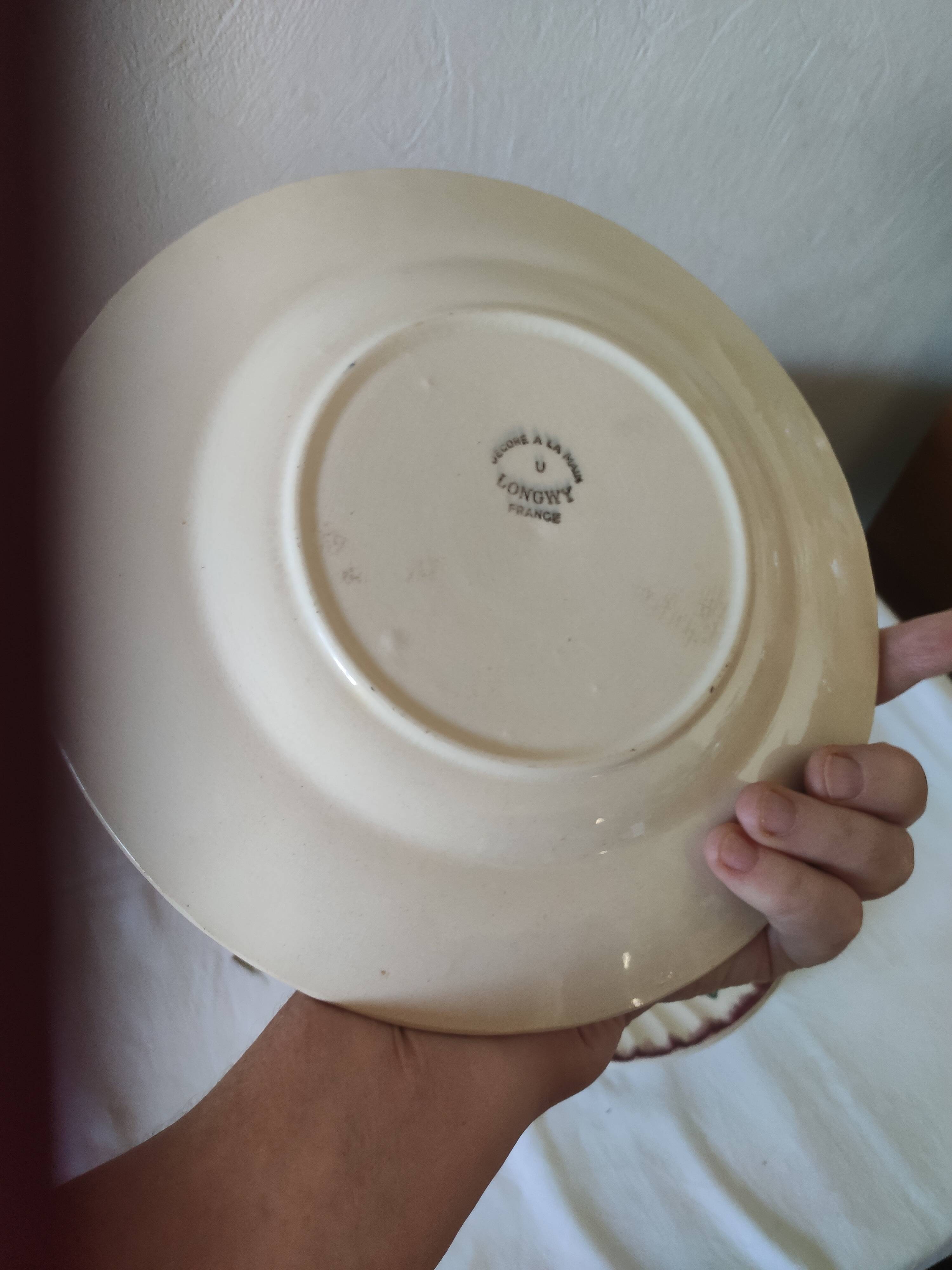 Set of 5 flat plates, signed Longwy.