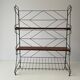 Free-standing shelf with a metal structure and 3 shelves, 1960s, Italy.