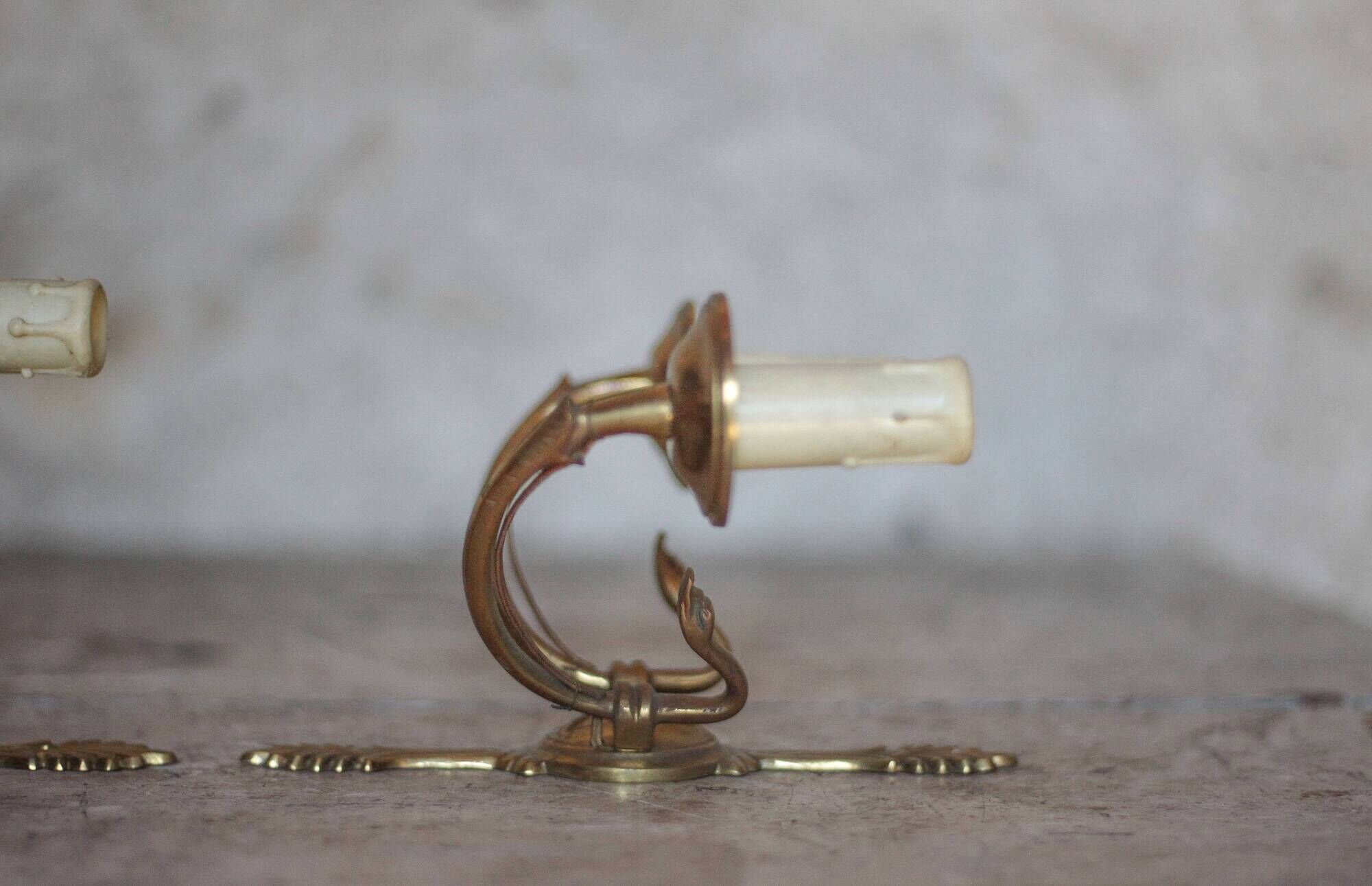 Pair of Empire style bronze wall lights, bronze wall light with palmette and swan neck.