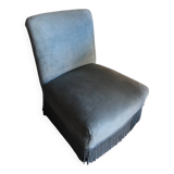 Vintage blue velvet fringed armchair.