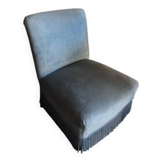 Vintage blue velvet fringed armchair.