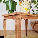 Antique coffee table with curved legs.