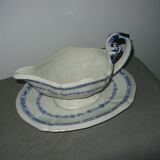 Saucière in Gien earthenware anse in the shape of a dolphin decoration garland 1900