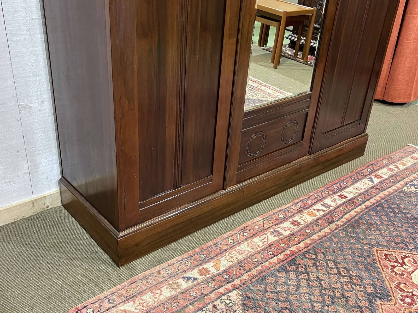 19th-century English mahogany three-door wardrobe.