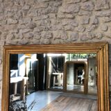 Mirror period 19th gilded with gold leaf 158.5cm / 113cm mercury ice pricked, parquet on the back.