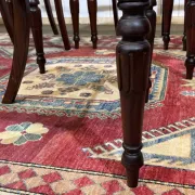 Set of 2 armchairs and 6 English mahogany chairs from the 1950s.