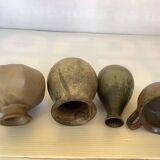 Eight brown ceramic pitcher vases