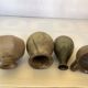Eight brown ceramic pitcher vases