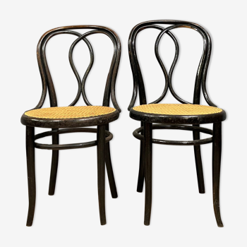 Pair of Thonet bistro chairs in blackened wood curved with steam around 1880