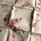 A set of 6 mismatched floral and bird-themed napkins