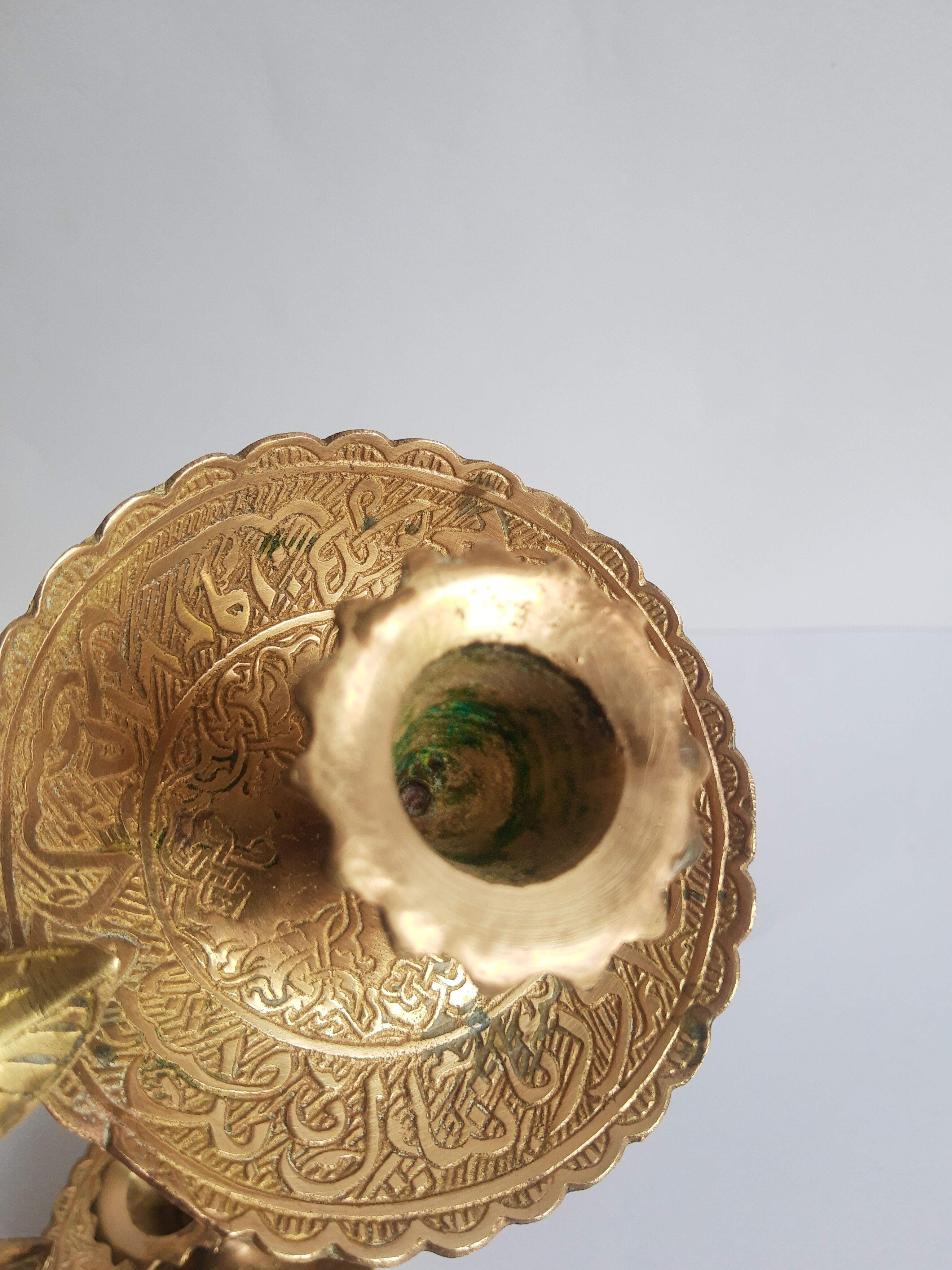Pair of vintage oriental golden brass cellar candlesticks