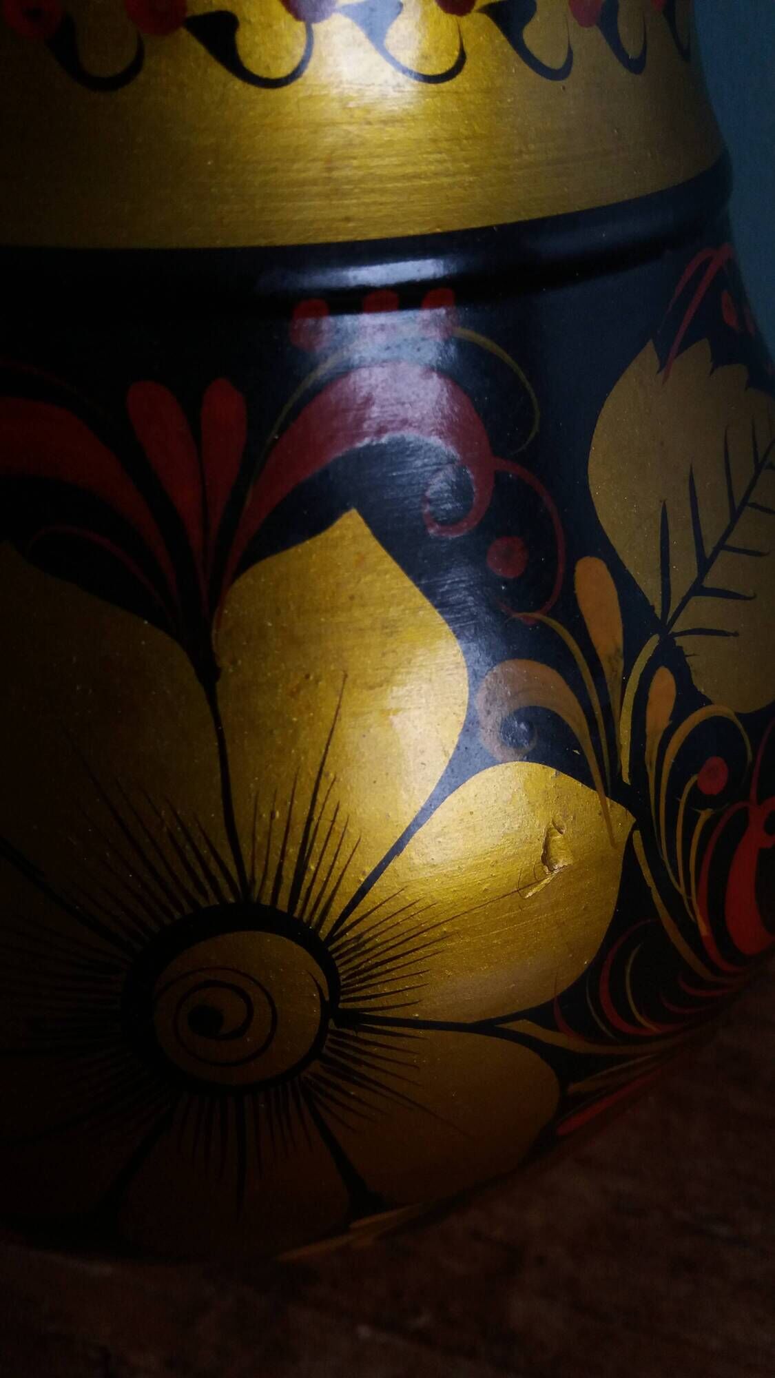 Khokhloma vase, Russian lacquered wood craftsmanship, hand-painted floral decoration.